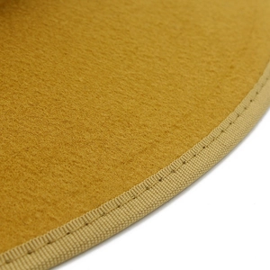 Detailed close-up of ginger wool felt hat with beige woven braided edge stitching