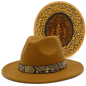 Detail of camel wool fedora with snake skin band and leopard print brim lining