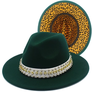 Detail view of dark green wool fedora with rhinestone trim and leopard print lining