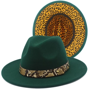 Detail of dark green fedora with snakeskin band and leopard print lining