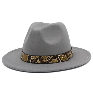 Detailed view of grey wool fedora hat featuring a snake print belt and gold metal rivets