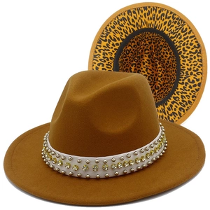 Detail of yellow fedora hat with leopard print brim and studded pearl headband