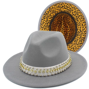 Detail of grey wool felt fedora featuring leopard print lining and rhinestone studded band