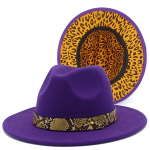 Detail of purple fedora hat featuring snakeskin band and leopard print inner lining