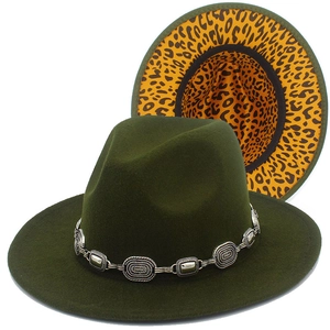 Detail of dark green wool fedora hat featuring leopard lining and vintage silver chain link
