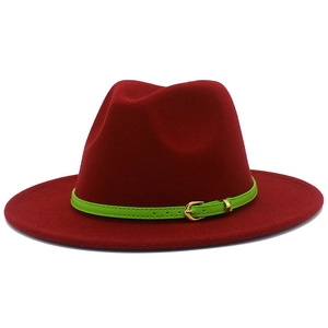 Close-up of a burgundy fedora hat with a green leather belt and gold buckle detail