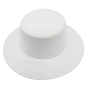 Close-up detail of white wool felt flat top wide brim hat with stitched edge craftsmanship