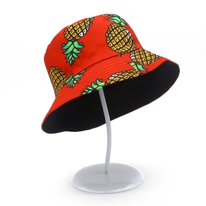 Unisex cotton bucket hat in vibrant red with yellow pineapple print for outdoor sun protection