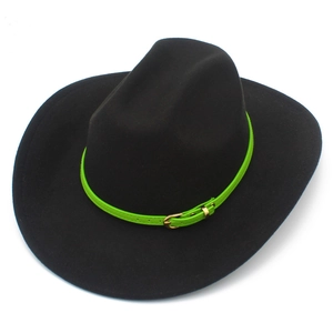 Detail of black felt cowboy hat with vibrant green belt and golden metal buckle