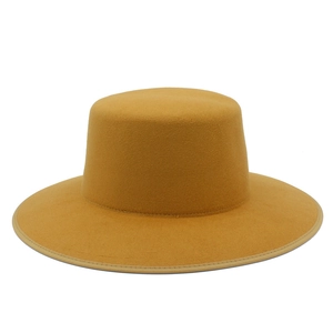 Detailed close-up showing the precise fabric edging of the yellow wool jazz hat