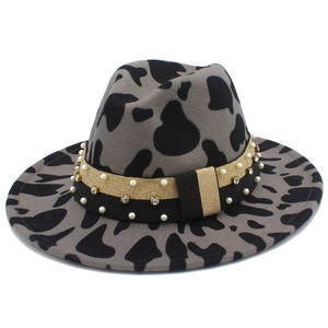 Cow print fedora hat with pearl and rhinestone band for stylish outdoor travel wear