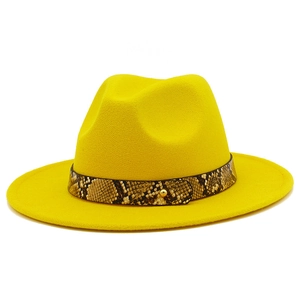 Close-up of bright yellow wool fedora hat featuring a stylish snakeskin leather band detail