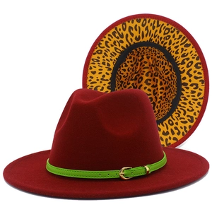 Deep red fedora hat detail featuring green strap buckle and stylish leopard print lining