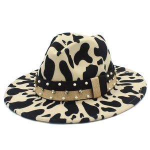 Detailed view of the cow print wool fedora featuring pearl and rhinestone trim
