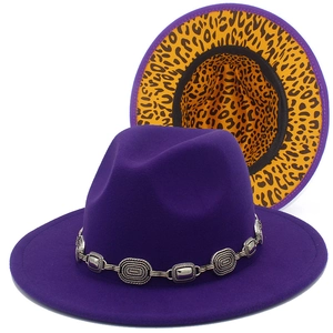 Detail showing deep purple wool fedora with metal chain and leopard print lining