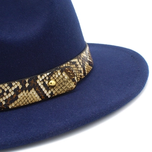 Dark blue fedora wool hat featuring a snakeskin leather band and gold metal rivet detail