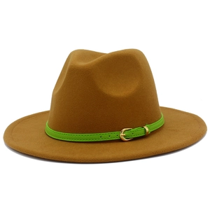 Macro view of brown fedora wool hat with bright green leather belt and golden buckle