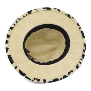 Close-up of stylish cow print fedora hat showing interior sweatband and brim detail