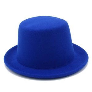 Detailed close-up showing the matte felt texture of the royal blue top hat with flat brim