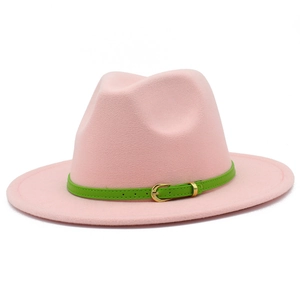 Detail of pink wool fedora hat featuring a green decorative band and golden metal buckle