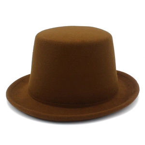 Detailed macro view of the brown wool felt texture and stiff brim on a classic top hat