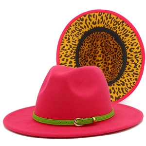 Detail of fuchsia fedora hat with green leather band and leopard print lining detail