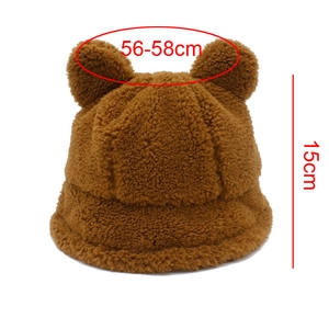 Detail of plush bear ear hat showing 56-58cm head circumference and 15cm height dimensions