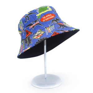 Detail of royal blue cotton bucket hat with vintage dinosaur encyclopedia print