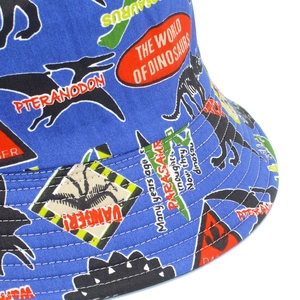 Detail of blue cotton sun hat with dinosaur prints and high-quality stitching seams