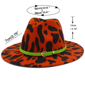 Detail of orange fedora with black spots showing dimensions of 12cm height and 7cm brim