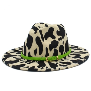 Classic cow print wide brim fedora hat with a green decorative band and metal buckle