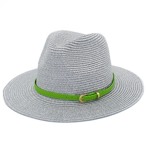 Silver woven straw sun hat with neon green faux leather band and gold buckle detail