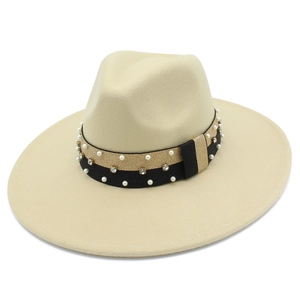 Detail of beige wide brim fedora hat featuring pearl and rhinestone decorative ribbon