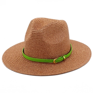 Classic tan straw Fedora hat with bright green leather band and gold buckle on white back