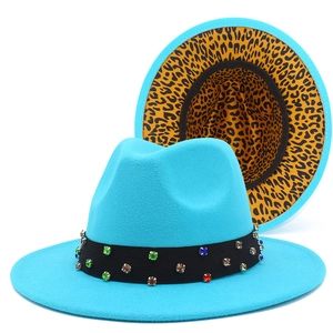 Detail of blue fedora hat with leopard print brim and rhinestone decorated band