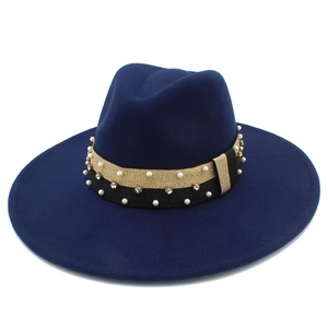 Detail of navy fedora hat with gold glitter band, pearls, and rhinestones trim