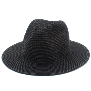 Macro view of detailed weaving texture on a classic black panama straw jazz hat
