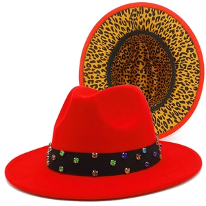 Red fedora hat with leopard print brim and rhinestone band shown from two angles