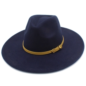 Detail of dark blue fedora hat featuring a narrow light brown leather belt with metal buckle