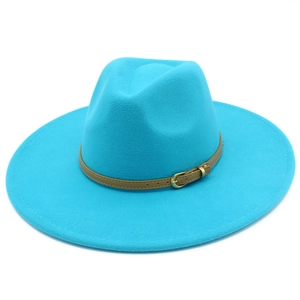 Detail view of the blue wool fedora hat featuring a stylish brown leather buckle strap band