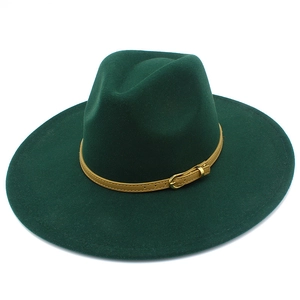 Detail of dark green wide brim fedora with brown leather band and gold metal buckle