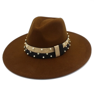 Detail of dark brown wool fedora hat featuring black gold band with pearls and rhinestones