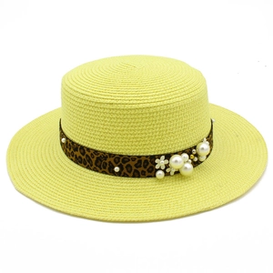 Straw boater hat with leopard ribbon and pearl accents for summer beach vacation