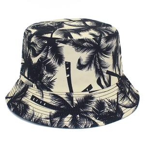 Reversible canvas bucket hat with black palm tree print for summer outdoor sun protection