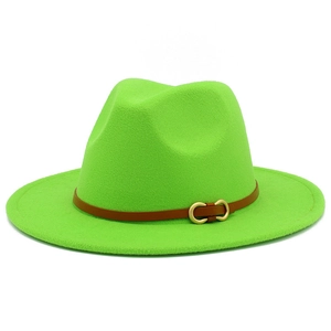 Detail of neon green wool fedora hat featuring a brown leather band and gold buckle