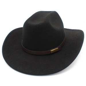 Detail of black wool felt cowboy hat with dark brown leather band and gold buckle