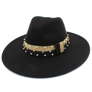 Detail of black wide brim felt fedora hat featuring pearl and rhinestone ribbon band