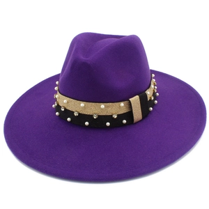 Detail of dark purple wool fedora featuring a decorative belt with pearls and rhinestones