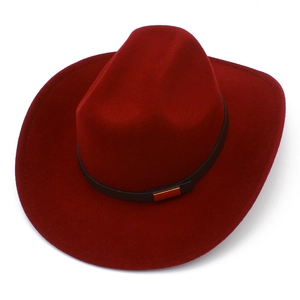 Detailed view of deep red felt cowboy hat with black leather band and gold buckle
