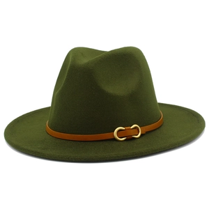 Detail of olive green fedora hat featuring a brown leather band and gold metal buckle
